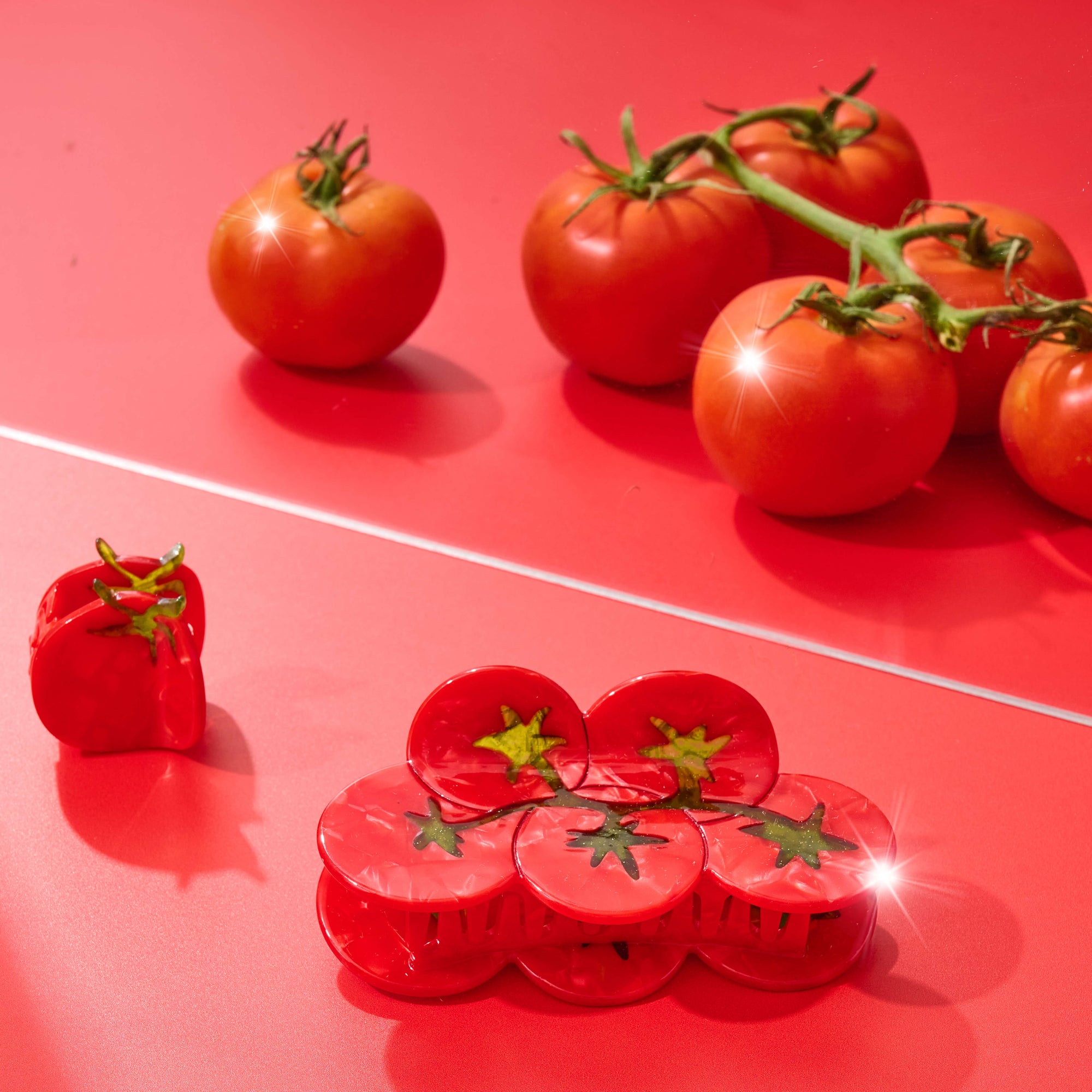 Red tomatoes on a red surface
