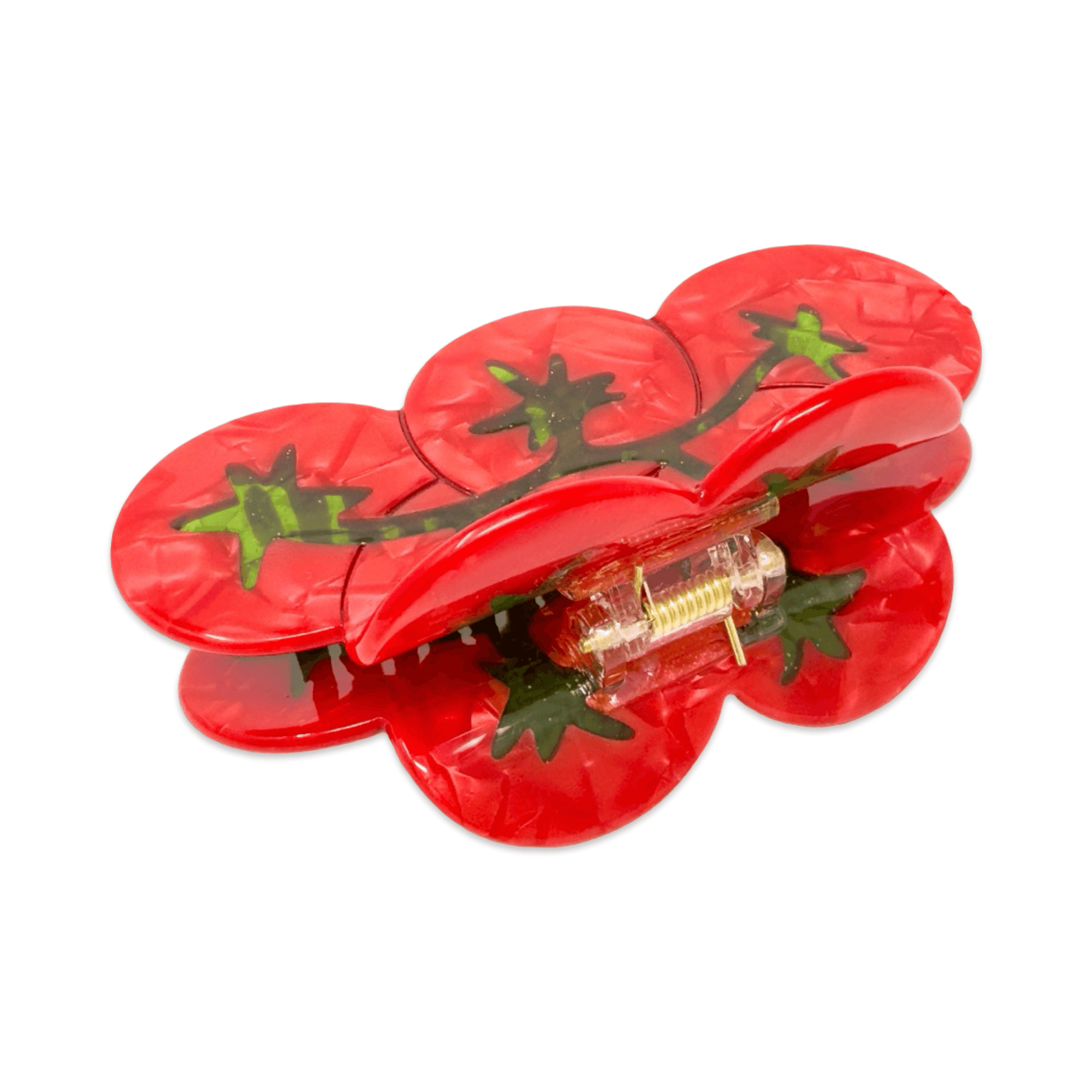 Red hair clip with tomato design on a white background