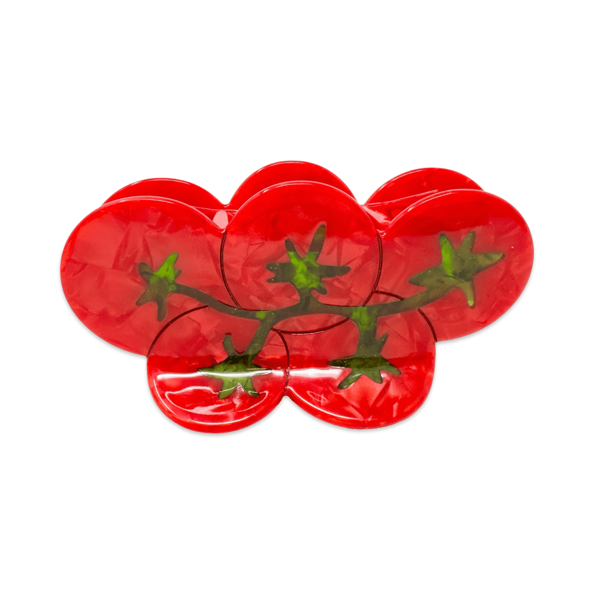 Red plastic tomato-shaped hair claw on a white background