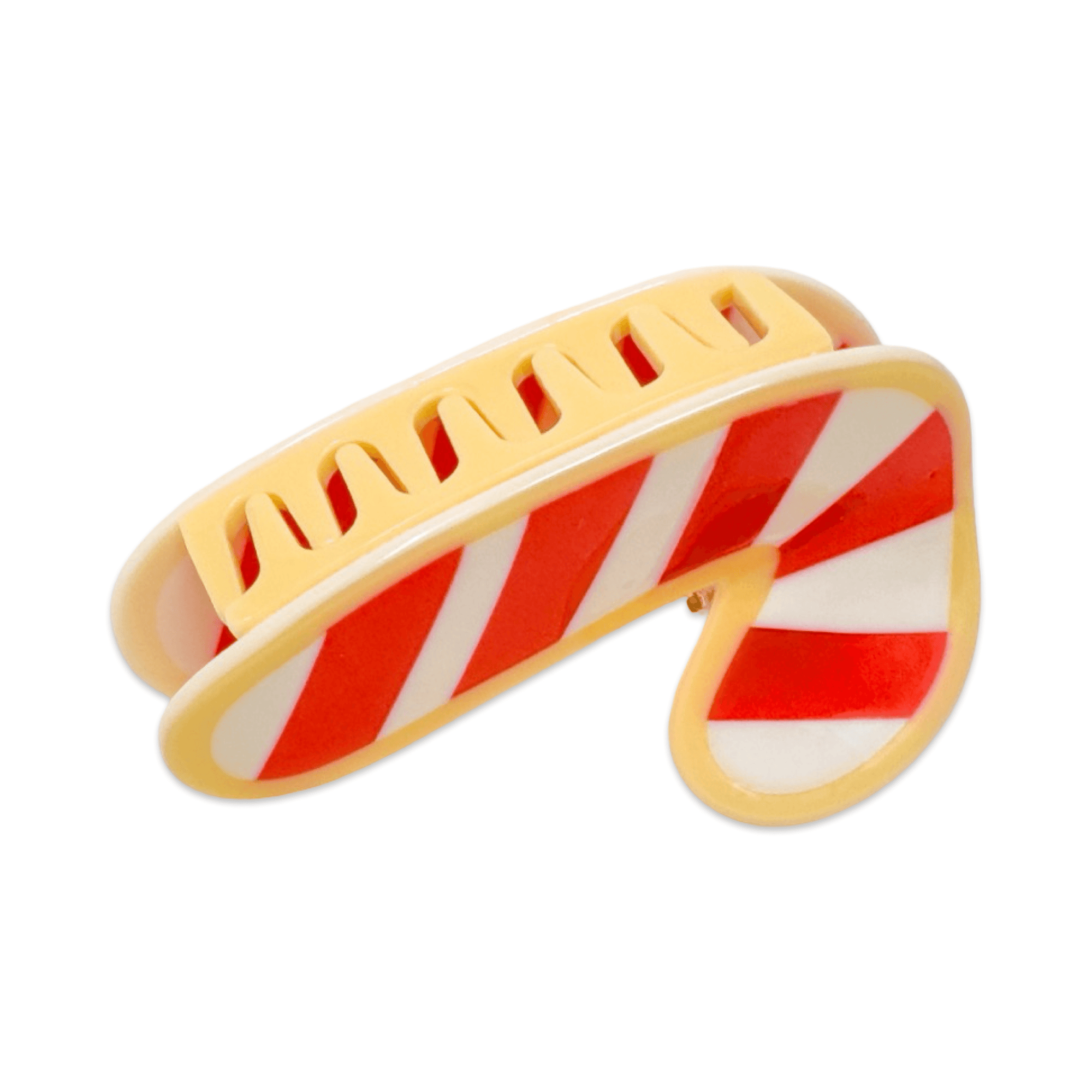 Yellow and red striped candy cane-shaped clip on a white background
