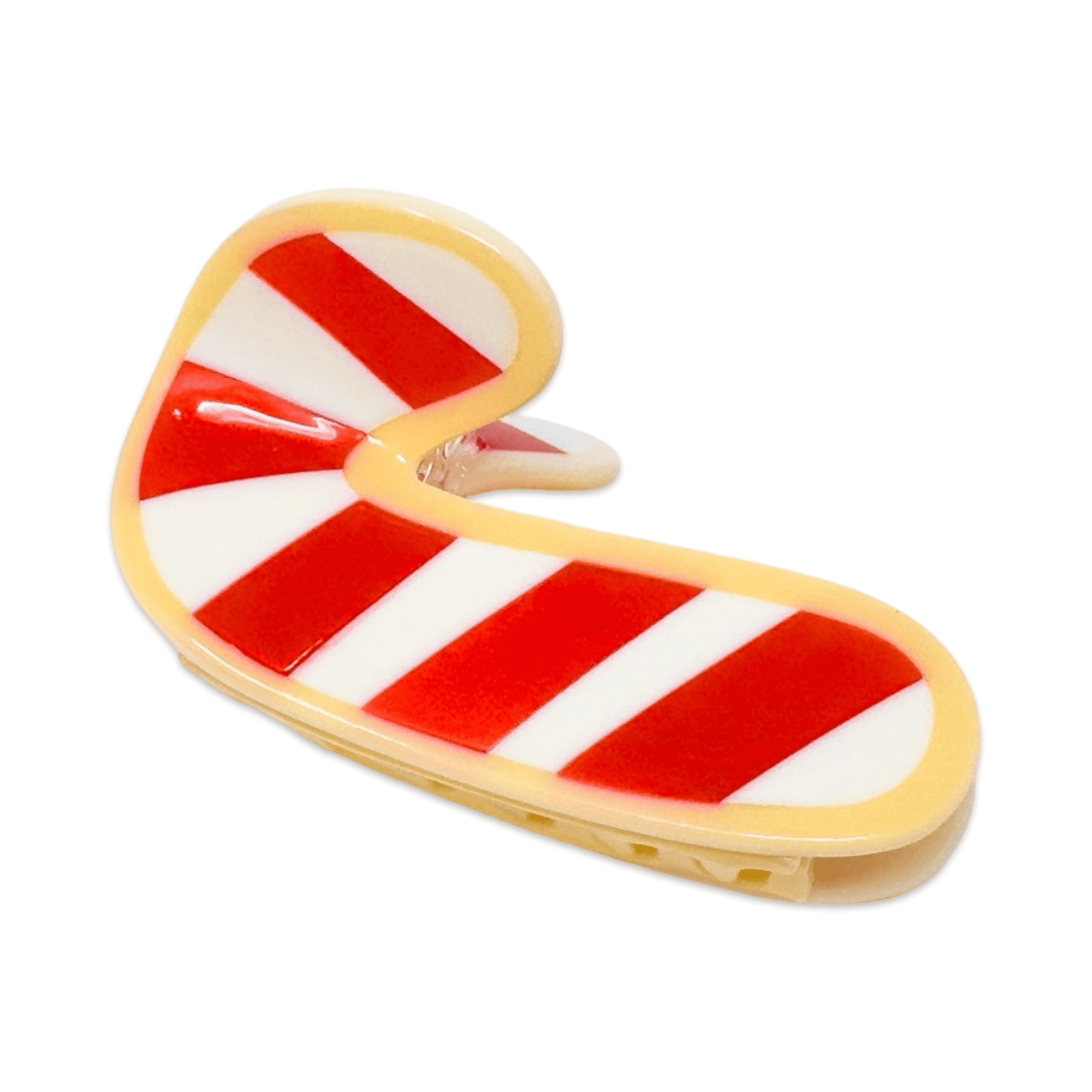 Candy cane-shaped cookie hair claw on a white background